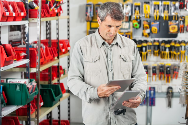 mechanic-reading-tablet-in-shop