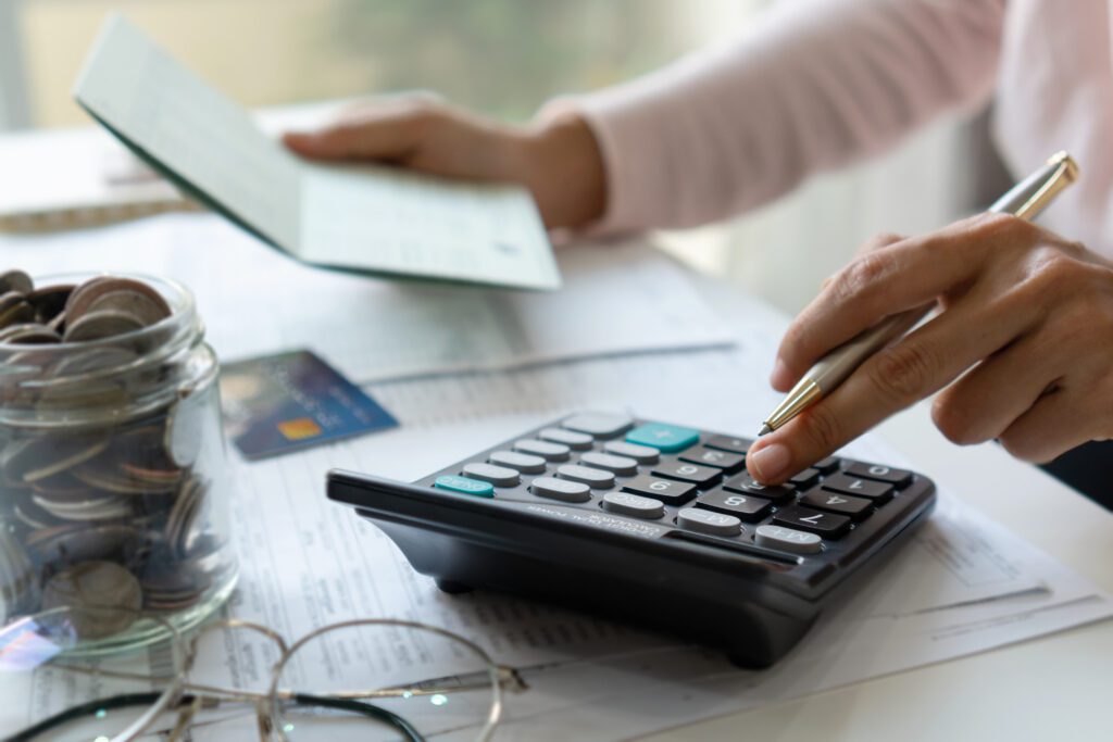 woman-with-calculator-and-checkbook