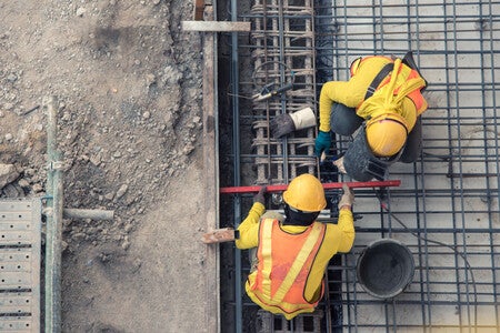 Aerial,View,Of,Construction,Worker,In,Construction,Site