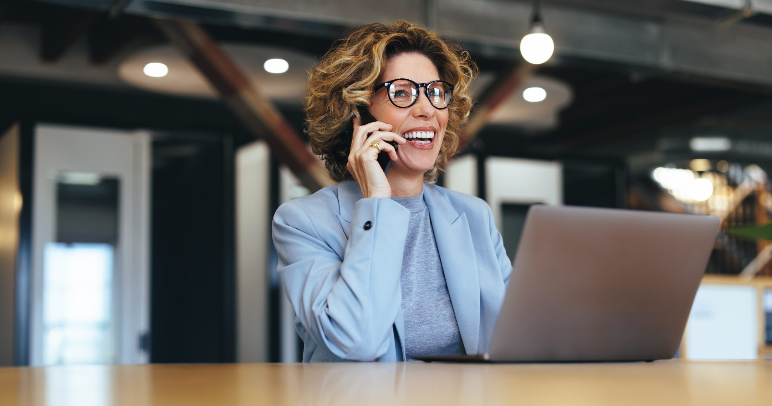 Woman discussing business affiliate loan programs over the phone