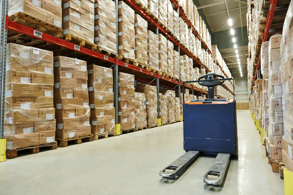 Forklift in a warehouse full of inventory